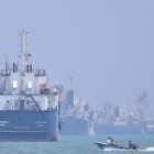 Tanker set ablaze after being struck by projectile in the Strait of Hormuz off the coast of Oman