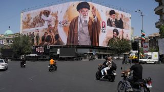 Iran begins late supreme leader's final journey; airspace, streets remain shut